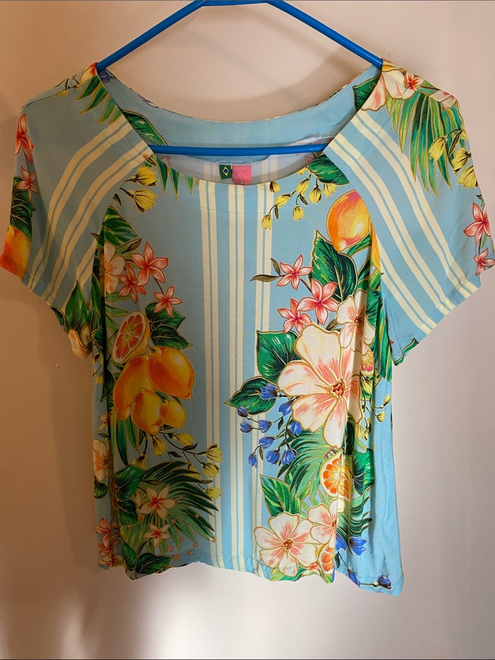 Farm Rio top features a vibrant tropical print